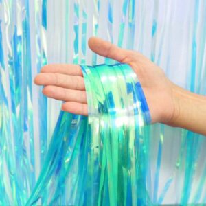 Entdecke den schimmernden Partyvorhang, der je nach Lichteinfall von Blau zu Grün wechselt. Ideal für Meerjungfrauen- und Unterwasser-Themenpartys.